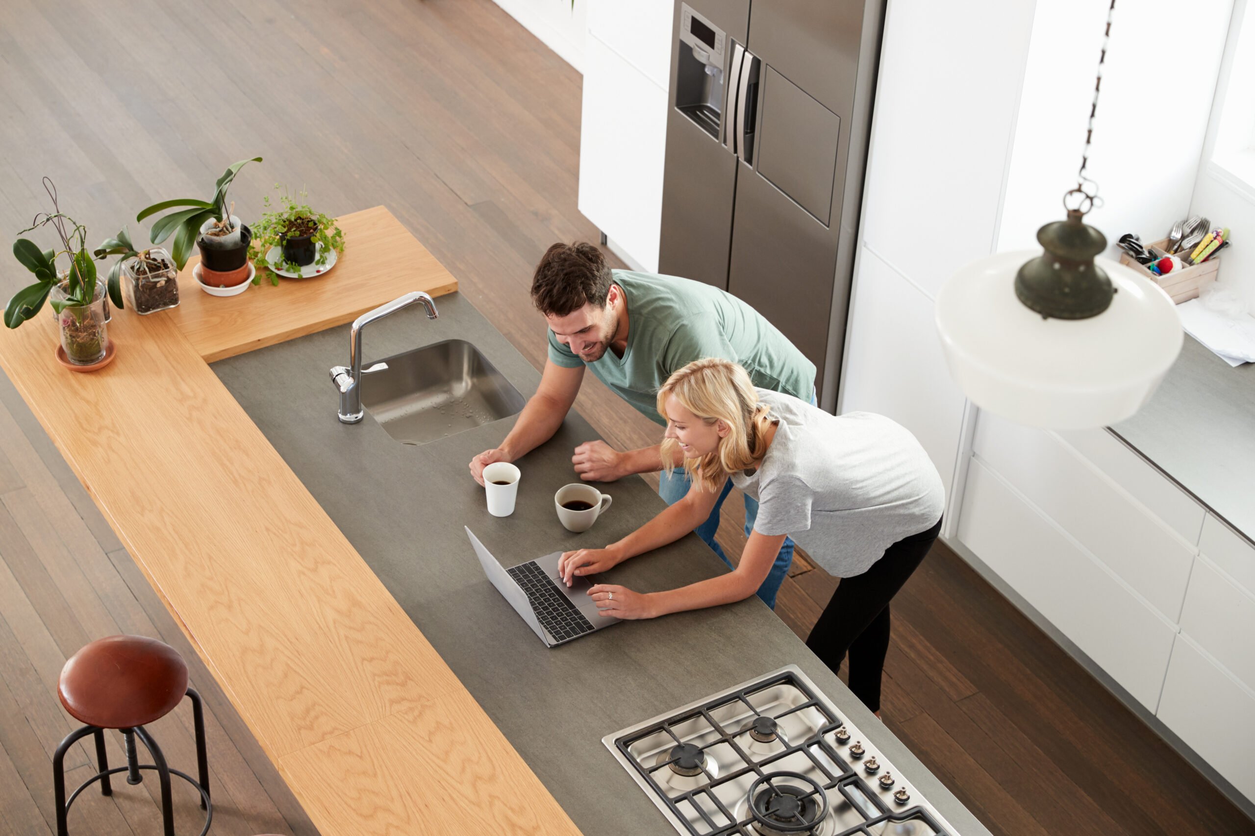 Couple drinking coffee in the kitchen